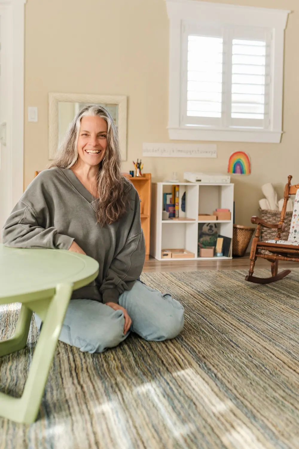 The founder of Chirping Spirits Montessori School photographed in her classroom