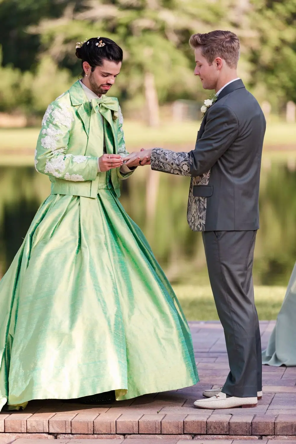 Same-sex wedding, two grooms exchanging rings