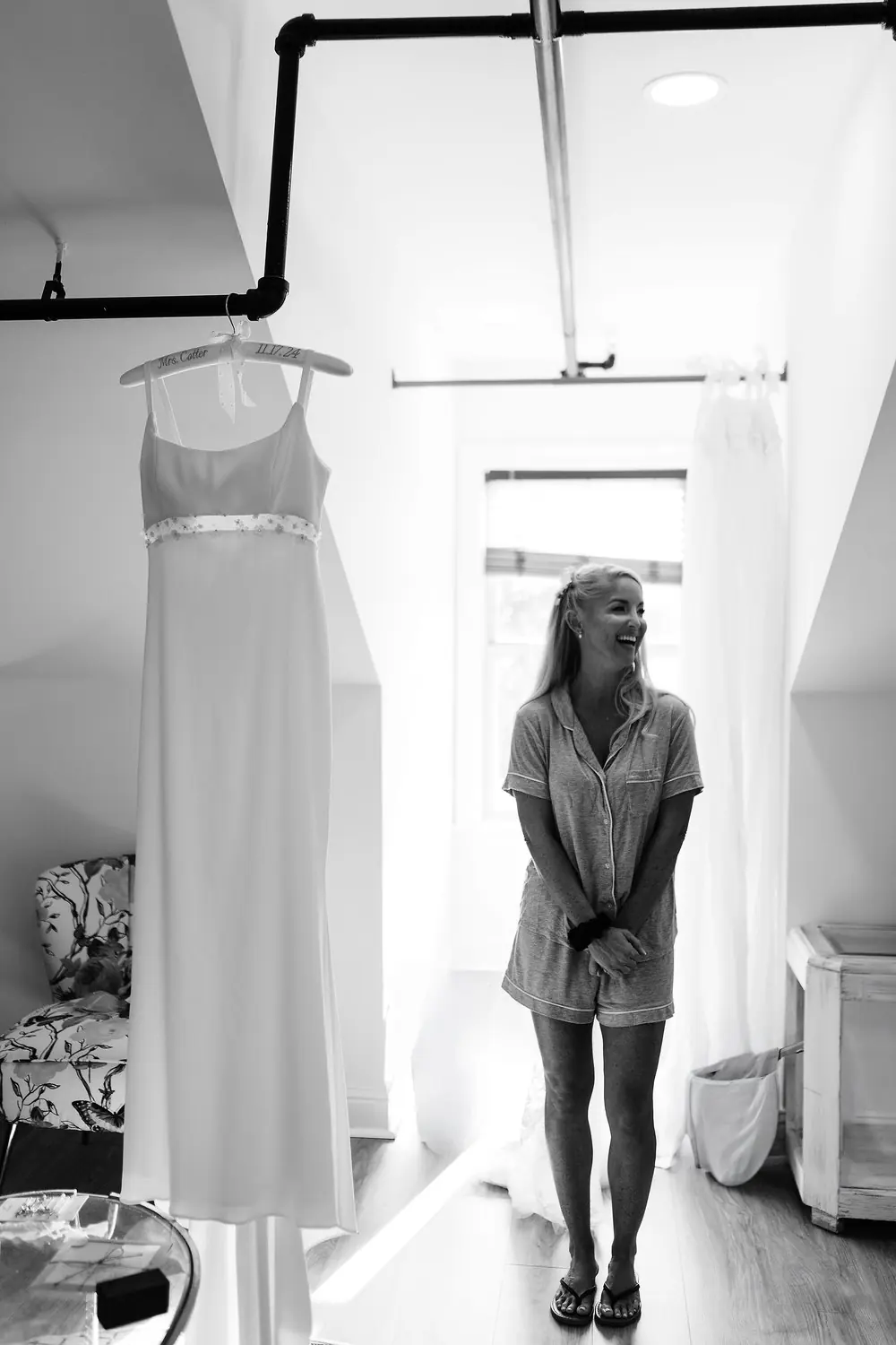 A bride laughing with joy while getting ready before her wedding
