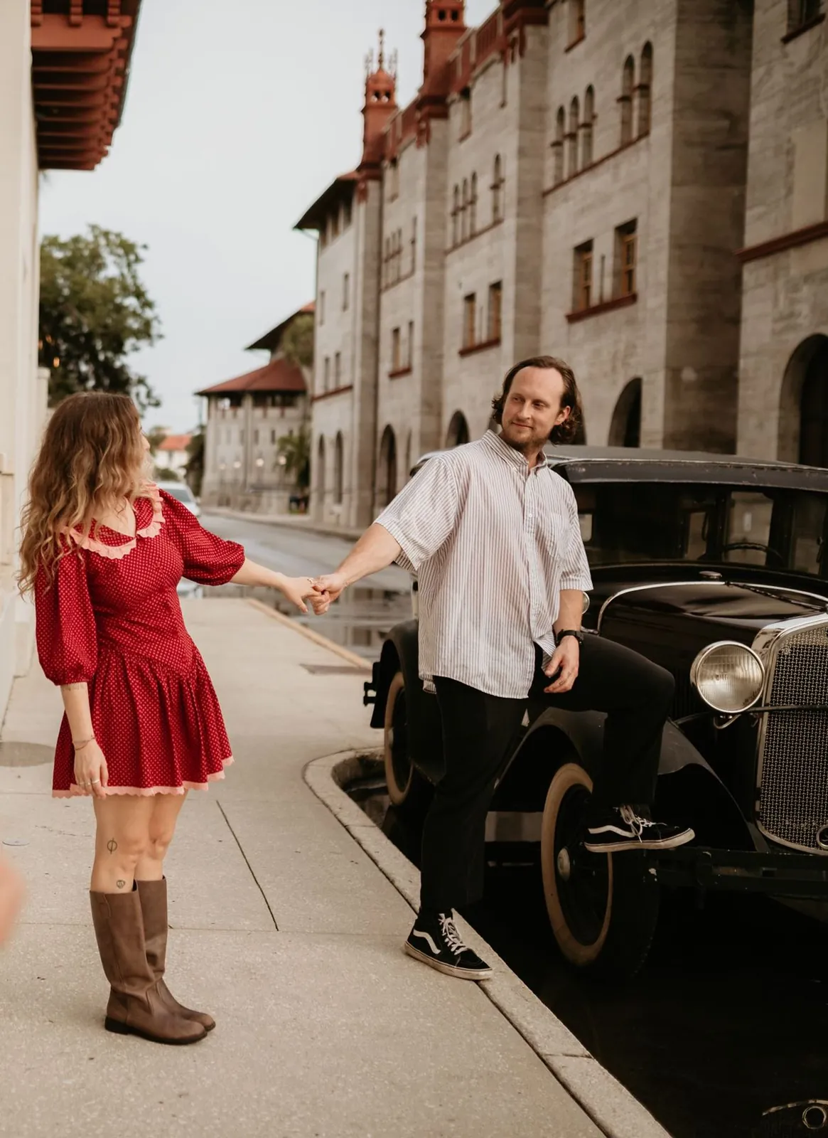 Engagement portrait by a vintage car at the Lightner Museum, St. Augustine