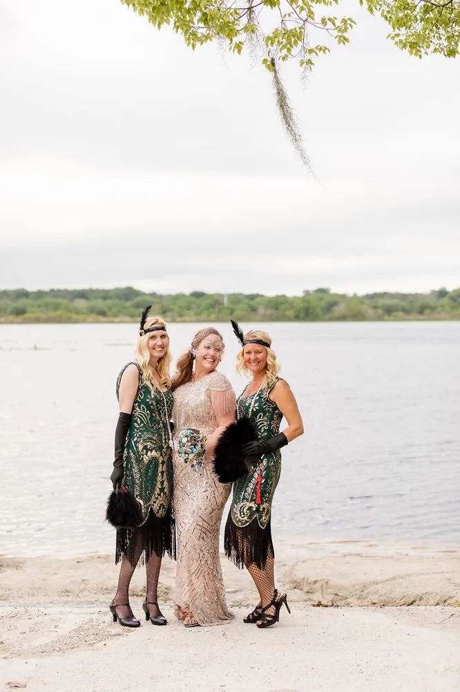 The bride with her flapper bridesmaids by the lake