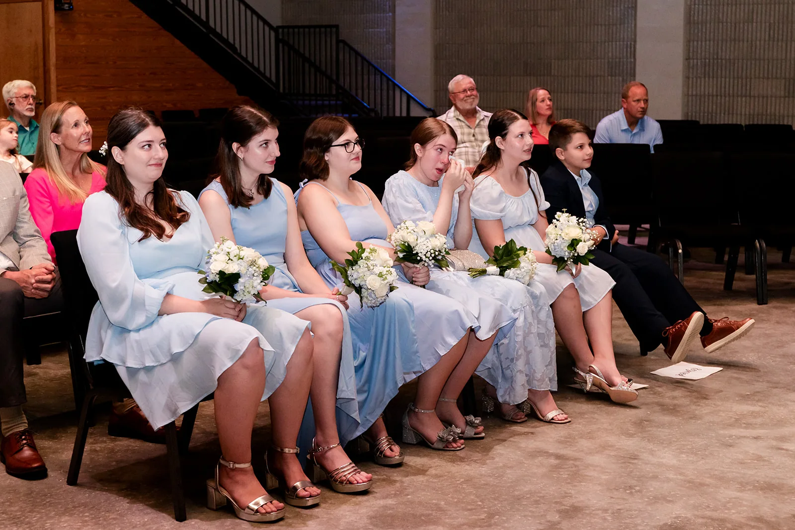 A family member wipes away tears during a vow renewal ceremony