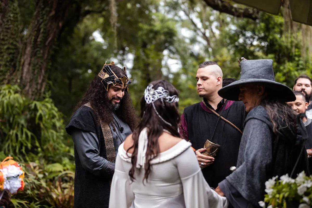 A Lord of the Rings ceremony, an Elf king and his bride with Gandalf