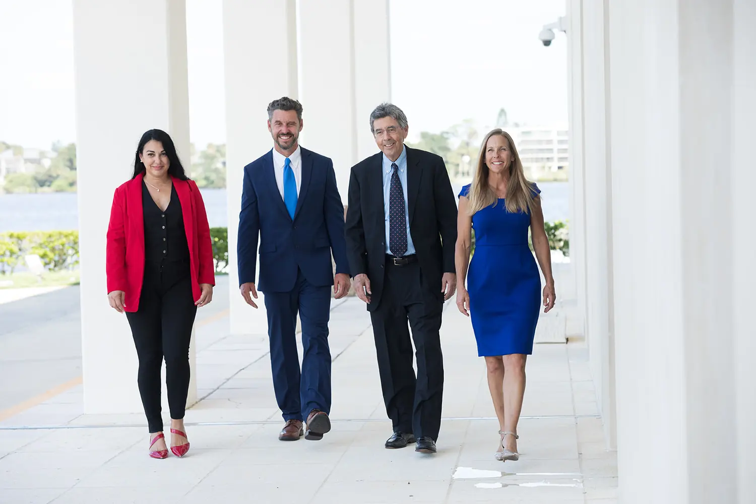 A corporate team portrait for a law office, photographed on the waterfront