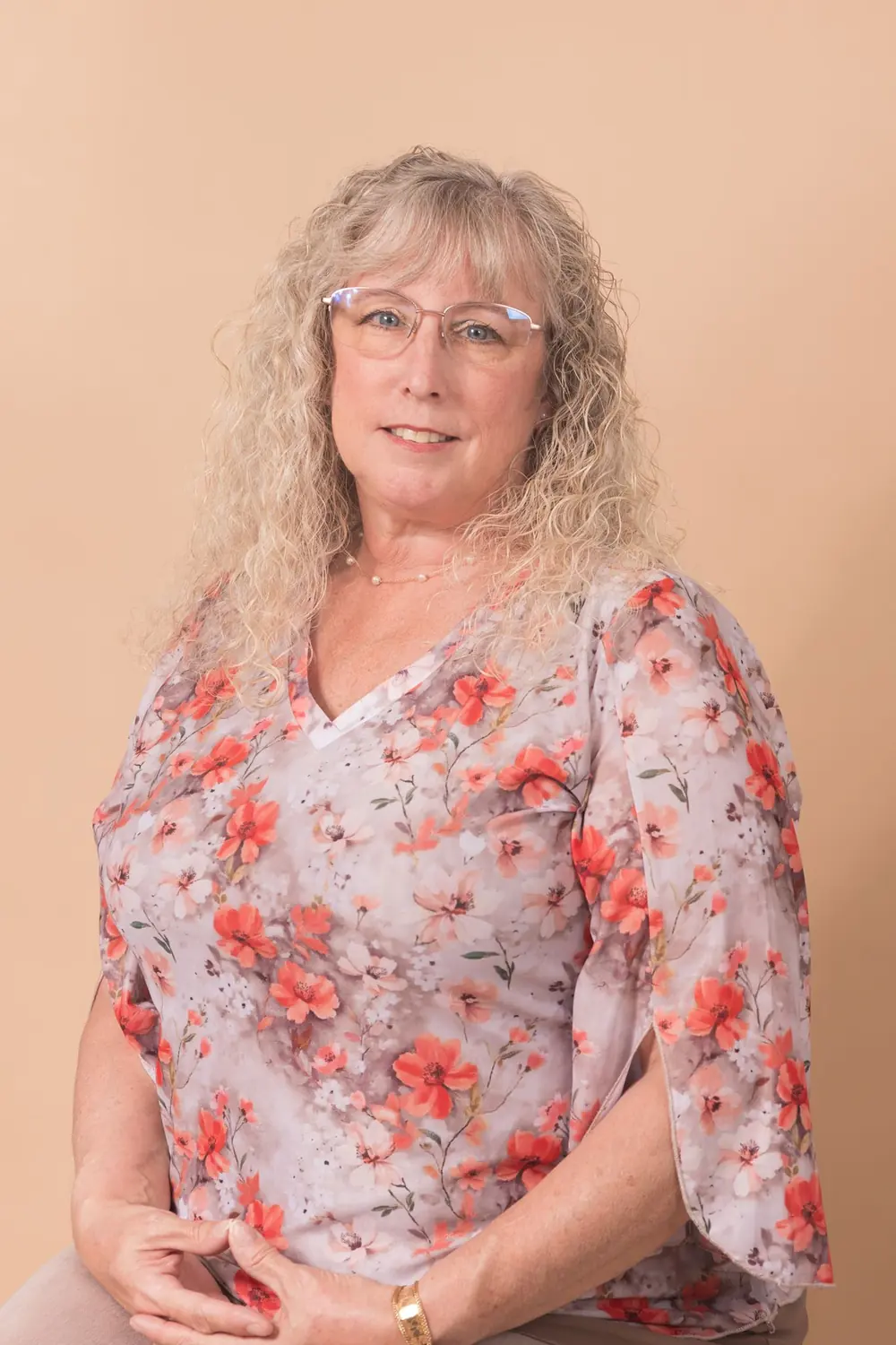 Studio headshot of a business professional on a clean neutral backdrop