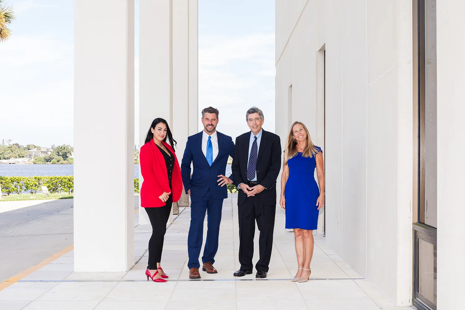 A corporate team portrait for a law office, photographed on the waterfront