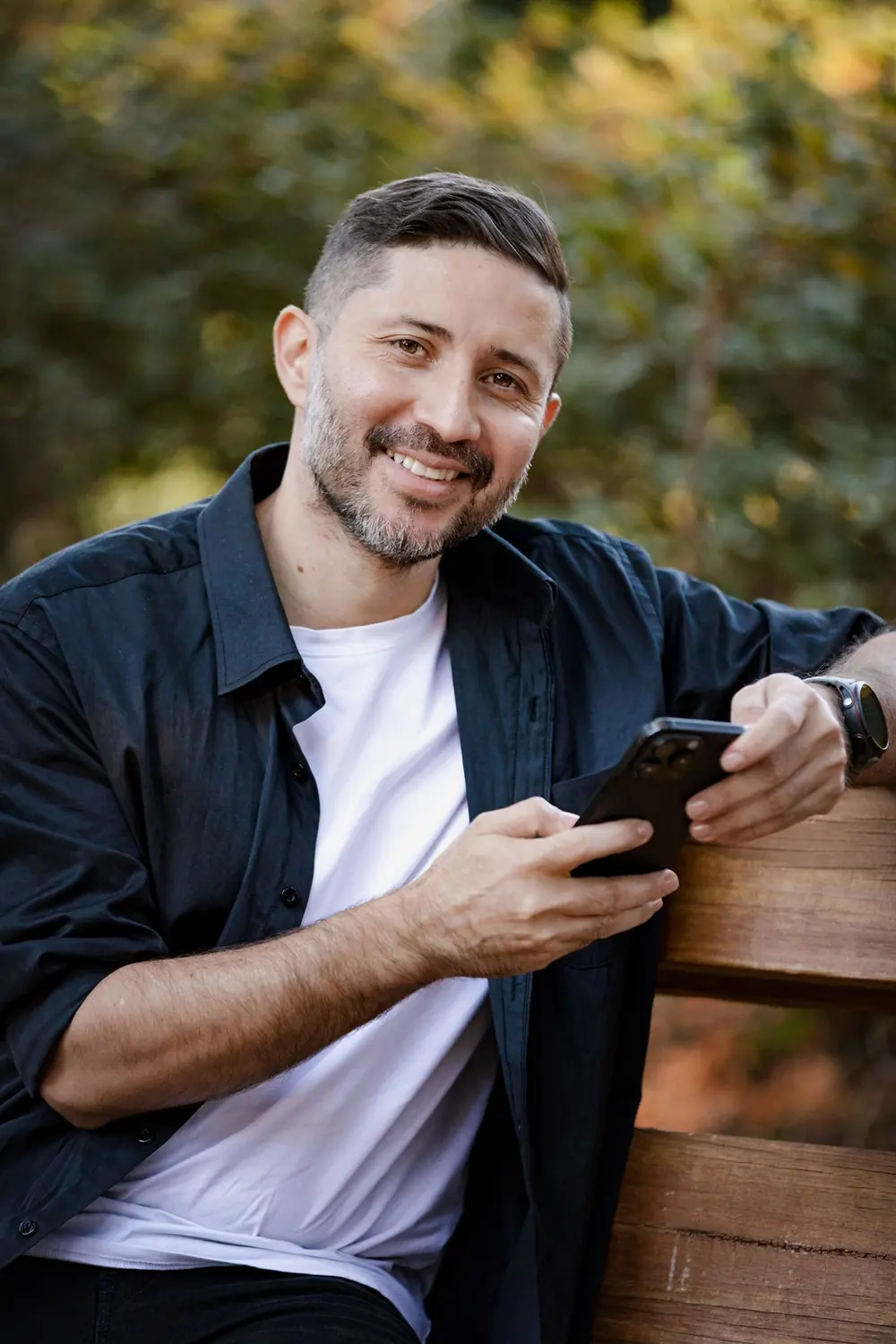Relaxed on-location headshot of a business owner photographed outdoors in natural light
