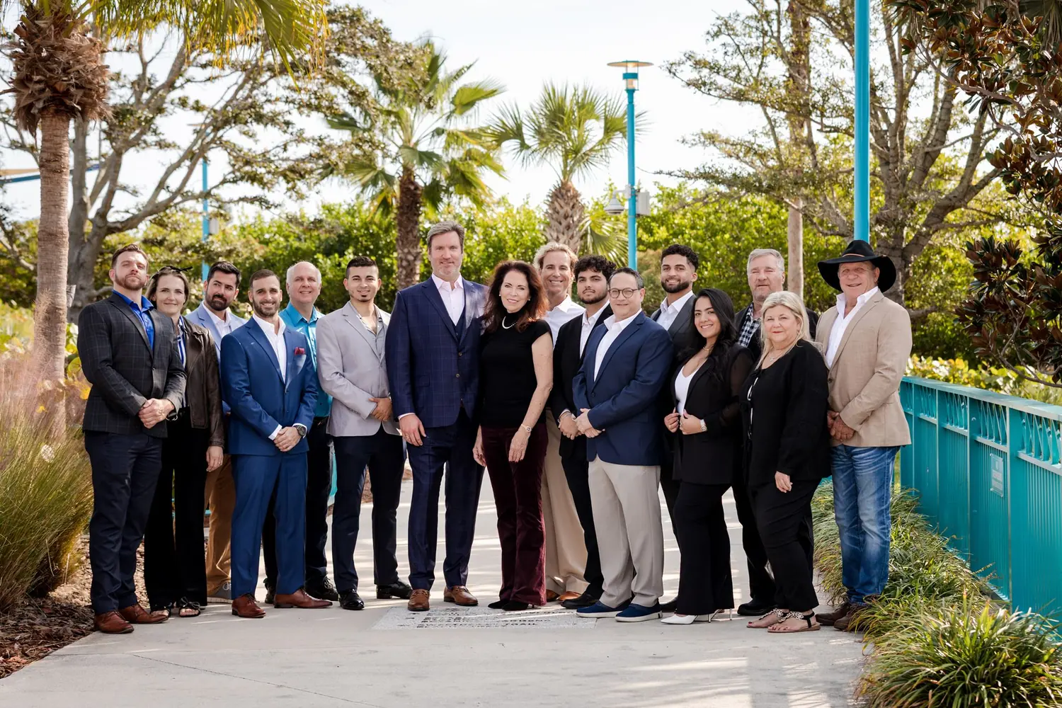 A full company team portrait for Trust Public Adjusting Group photographed outdoors in Florida