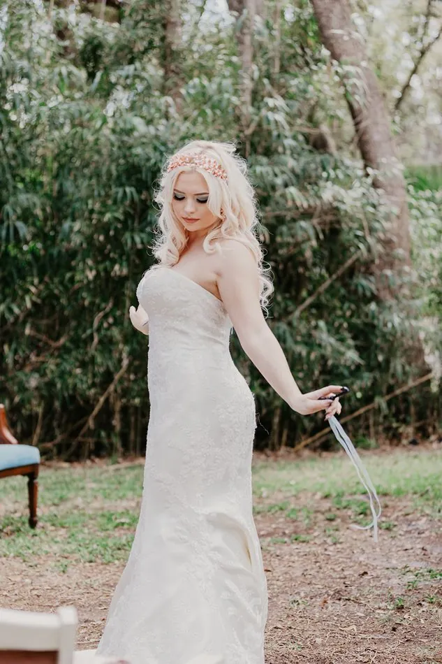A detail from the two brides Alice in Wonderland wedding