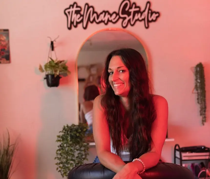 A studio owner photographed in her own salon